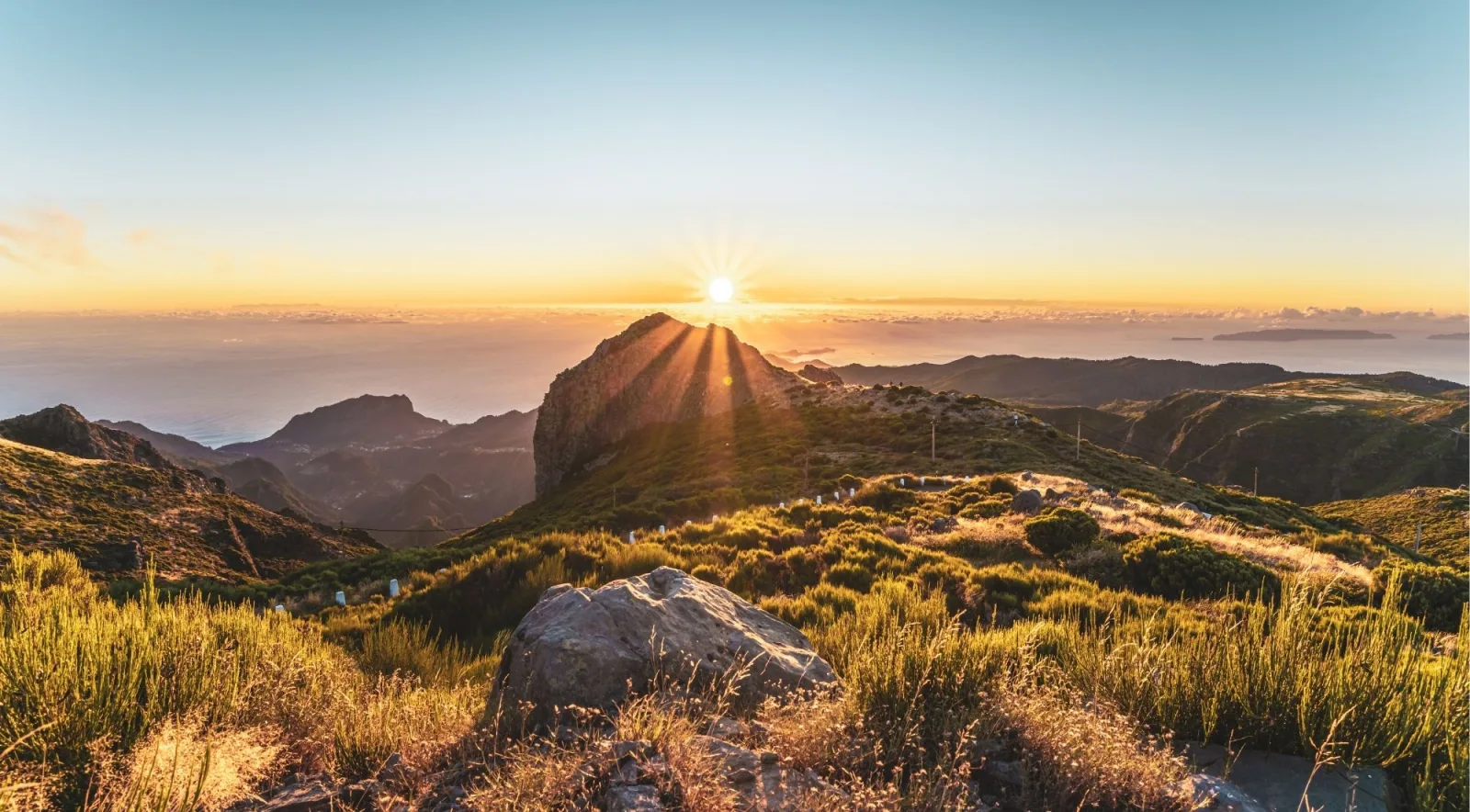 Sunburst over the ridge at Pico do Arieiro with a sea of cloud below
