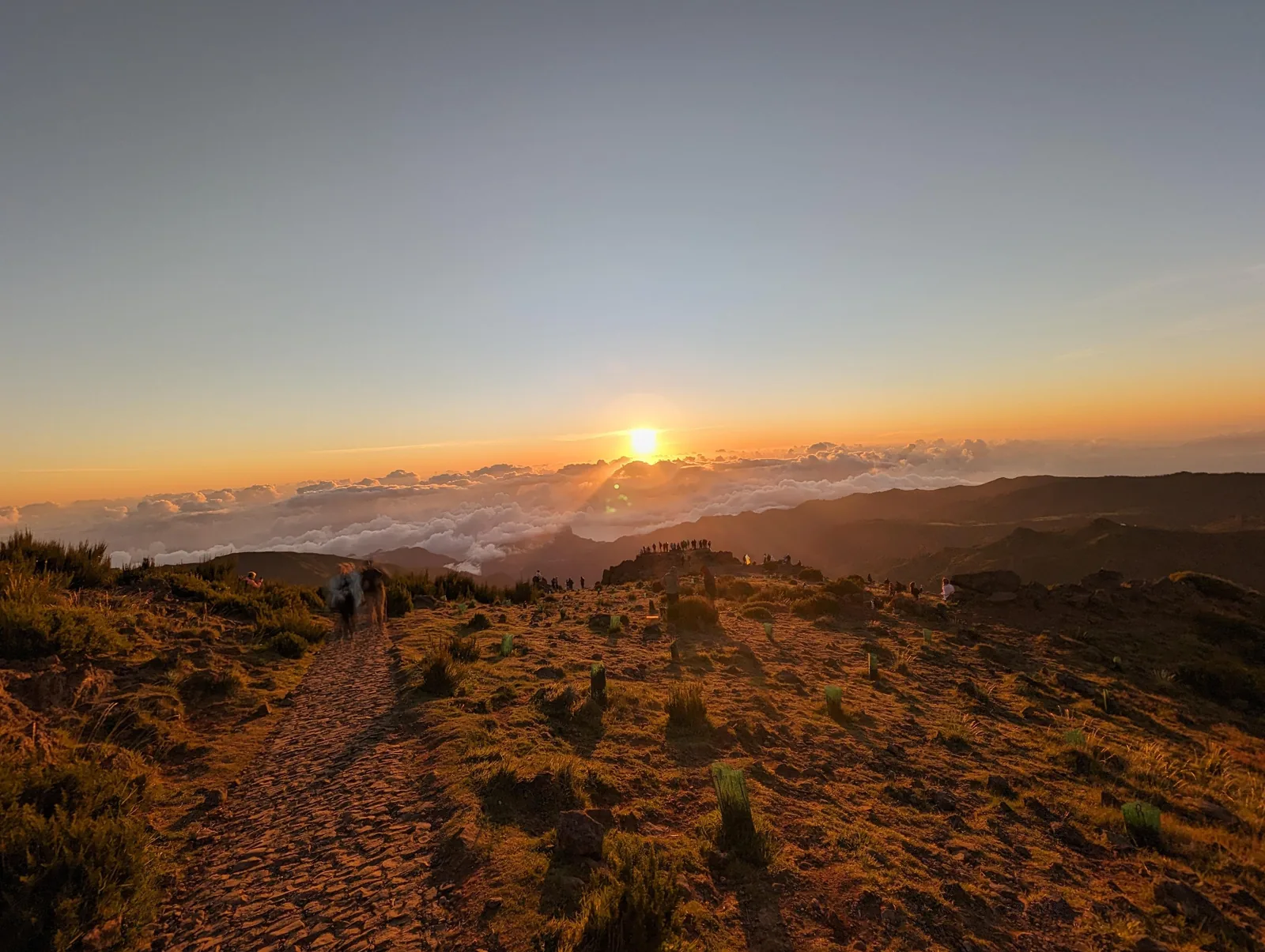 The path at Pico do Arieiro at sunrise, with the cloud layer below the ridge