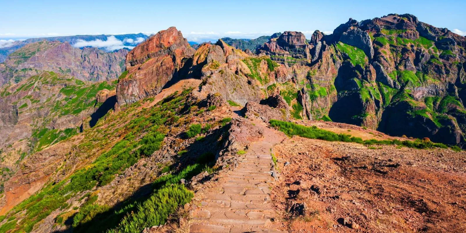 The red volcanic ridge path between Pico do Arieiro and Pico das Torres